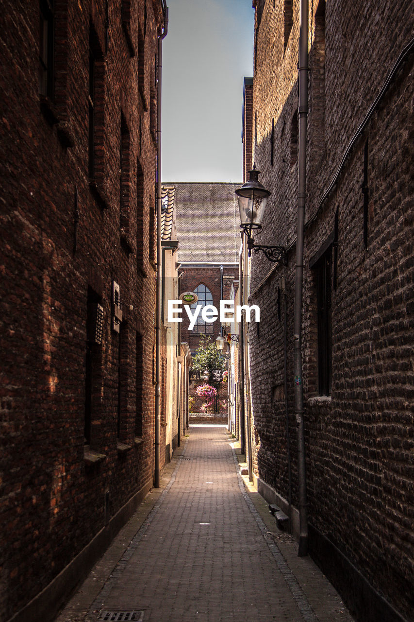 Alley amidst buildings in city