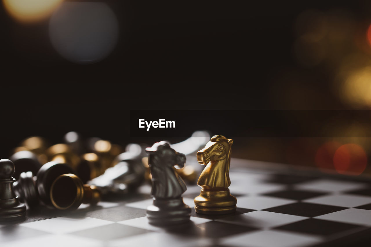 Close-up of chess board against black background