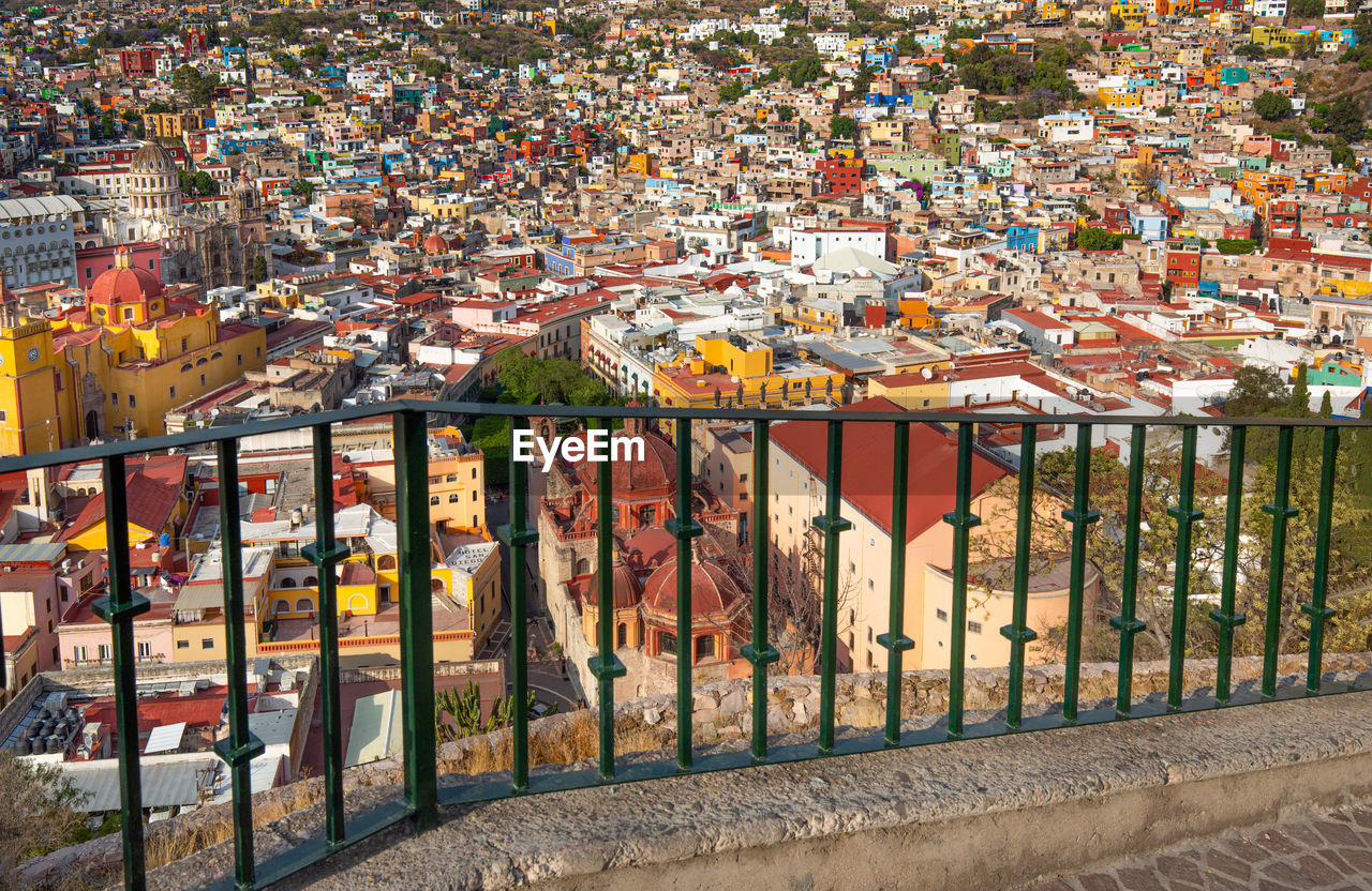 HIGH ANGLE VIEW OF MULTI COLORED BUILDING