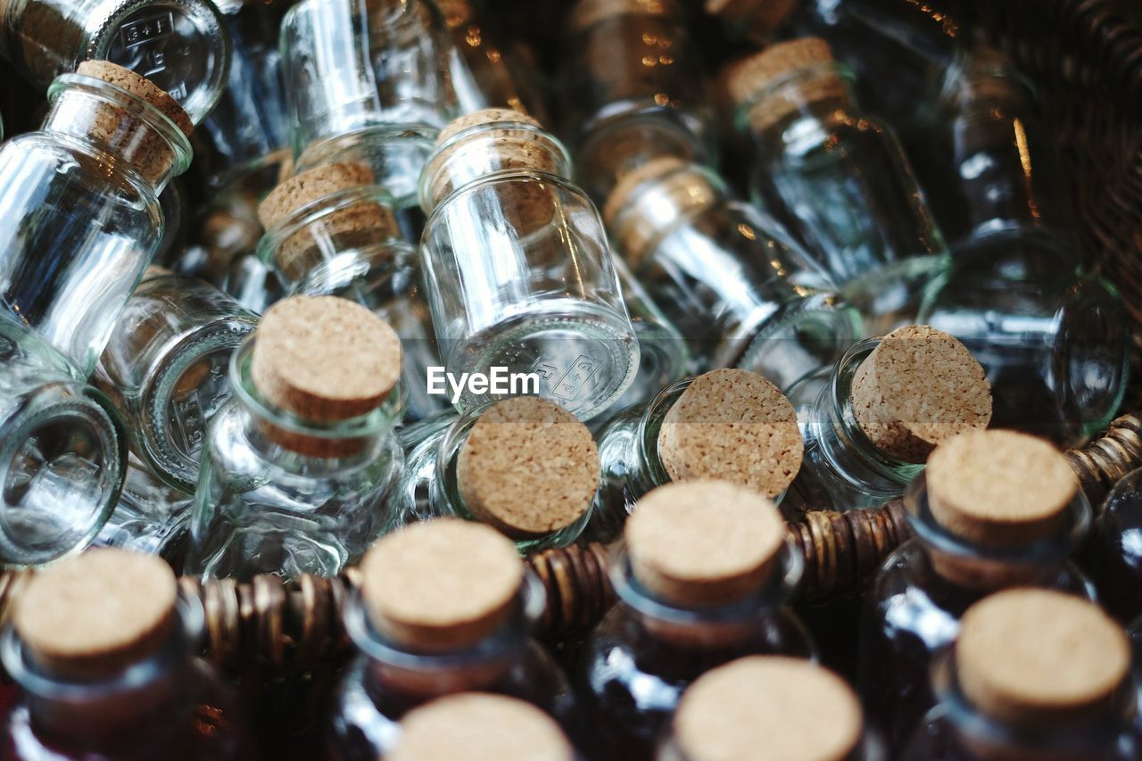 High angle view of small glass bottles