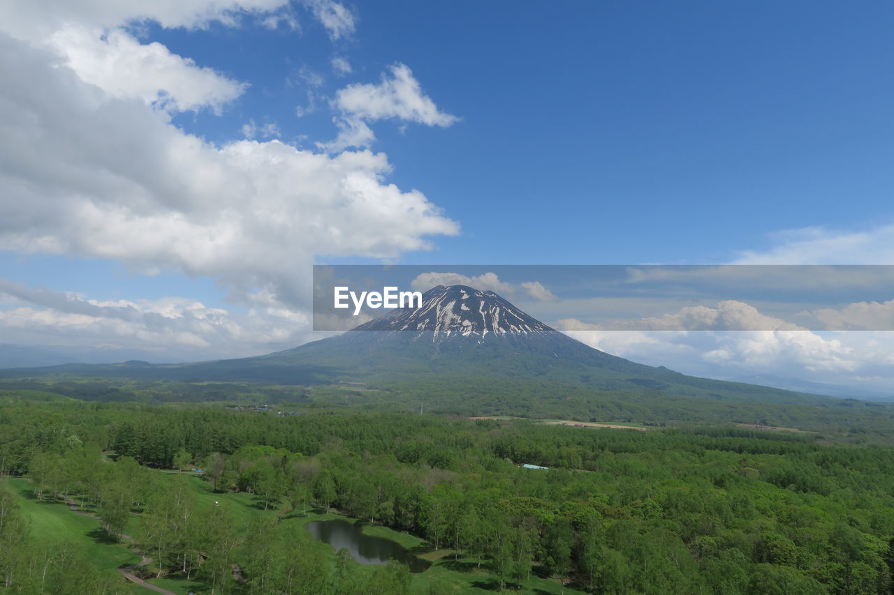 Scenic view of mountain against cloudy sky