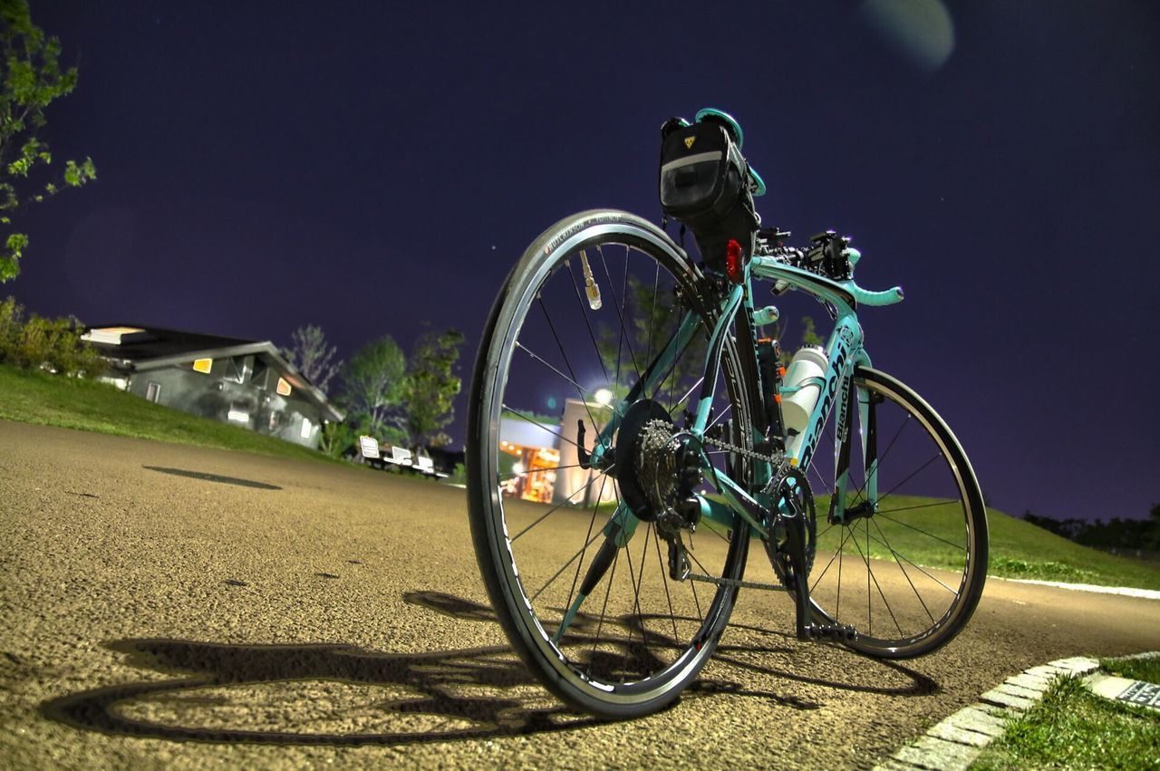 BICYCLES IN ILLUMINATED CITY