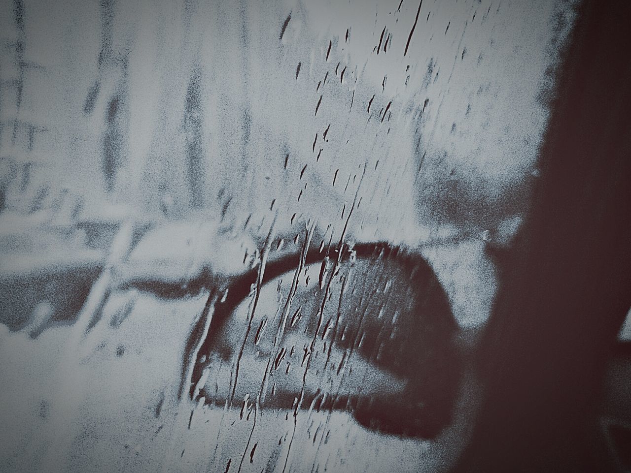 CLOSE-UP OF HUMAN HAND AGAINST WINDOW