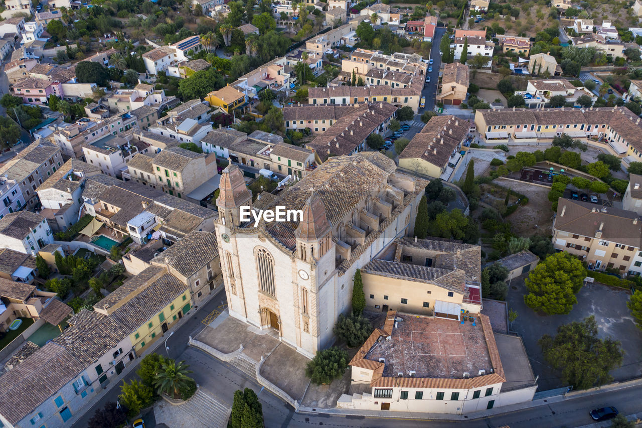 Spain, mallorca, calvia, helicopter view of parroquia sant joan baptista church and surrounding buildings