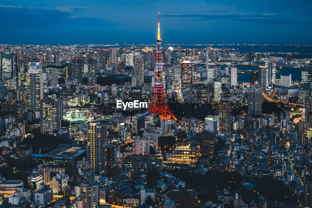 Aerial view of city lit up at night