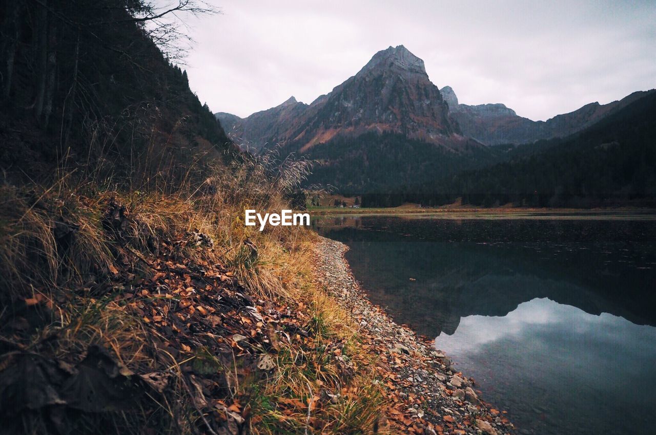 Scenic view of lake with mountains in background