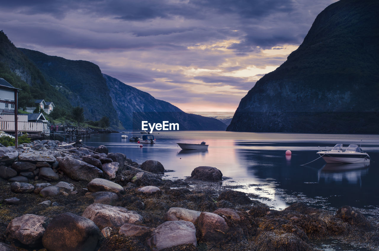 Scenic view of lake and mountains against sky