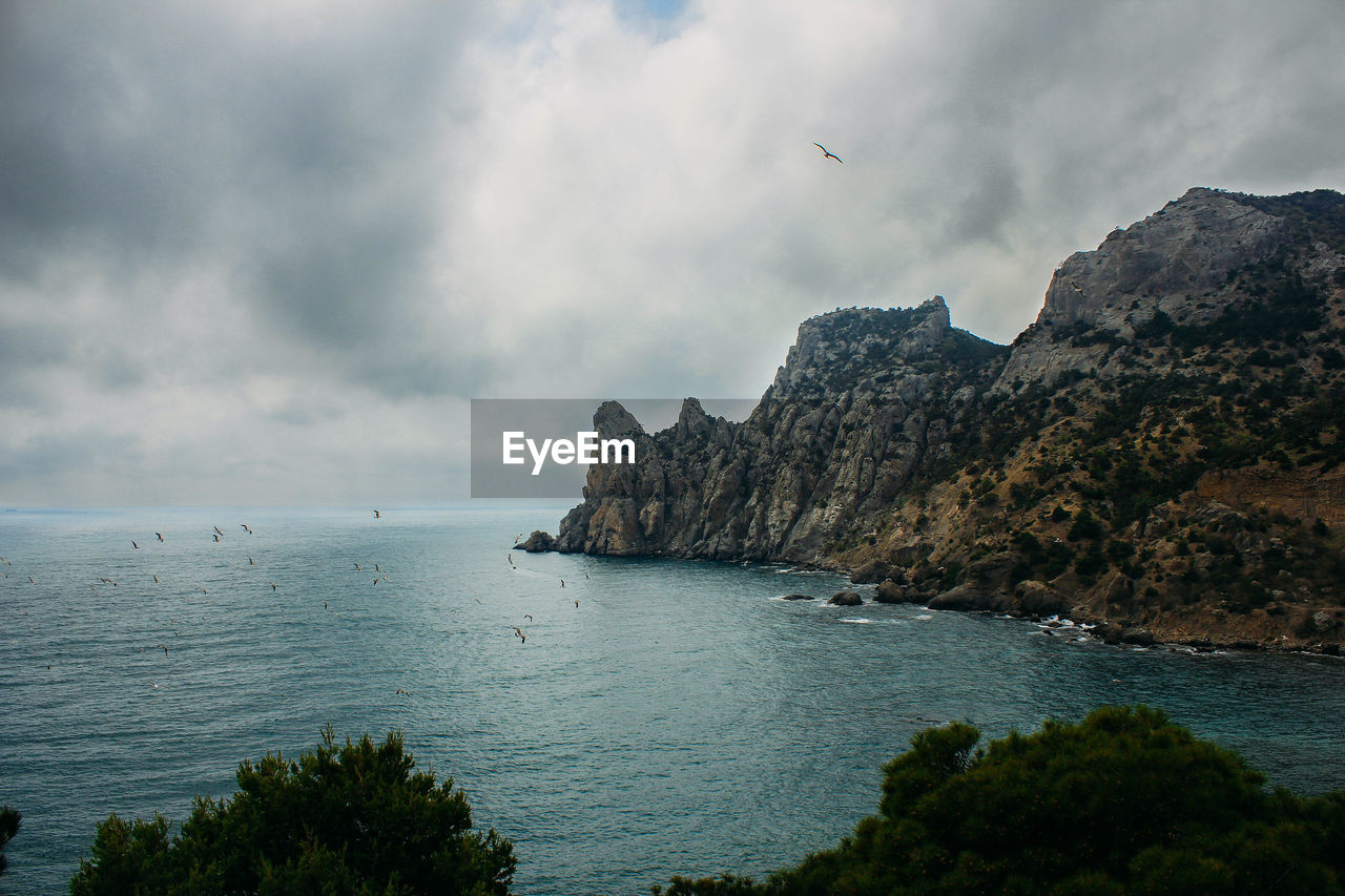 Scenic view of bay against sky