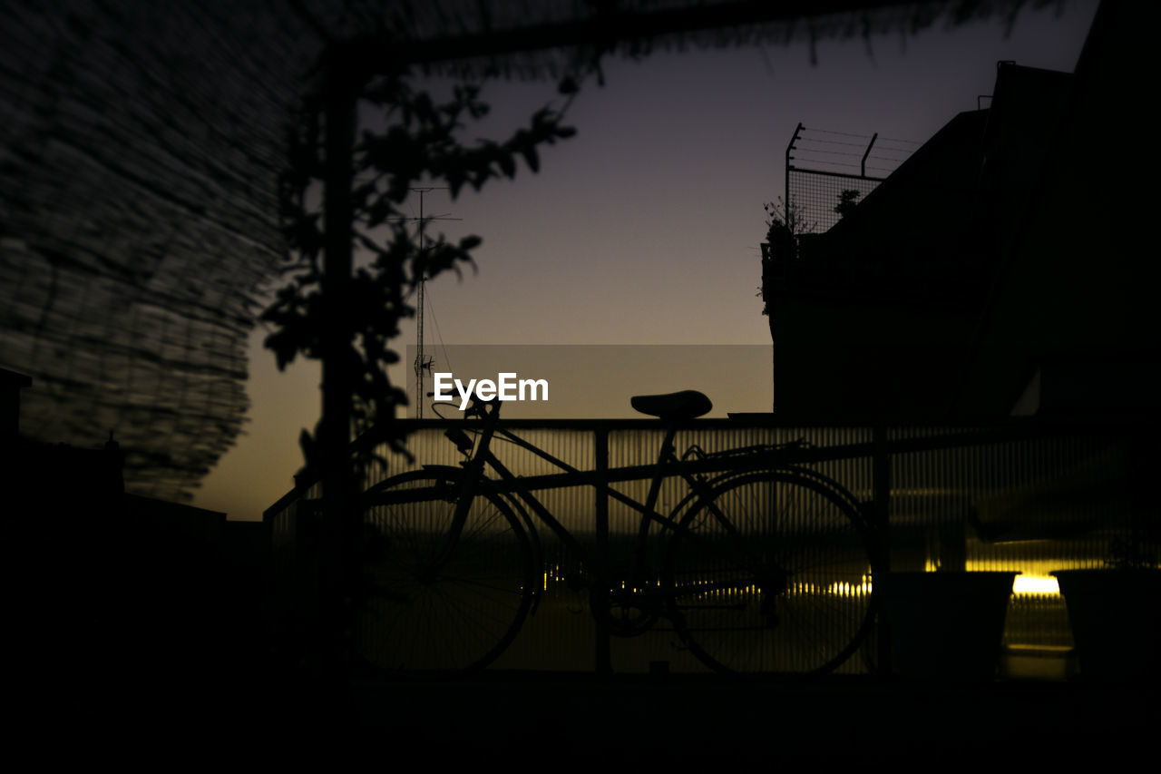 Silhouette of bicycle at night