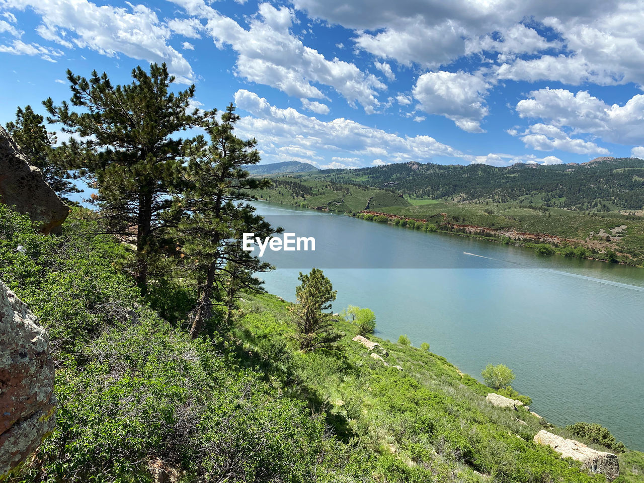 SCENIC VIEW OF LAKE BY TREES AGAINST SKY