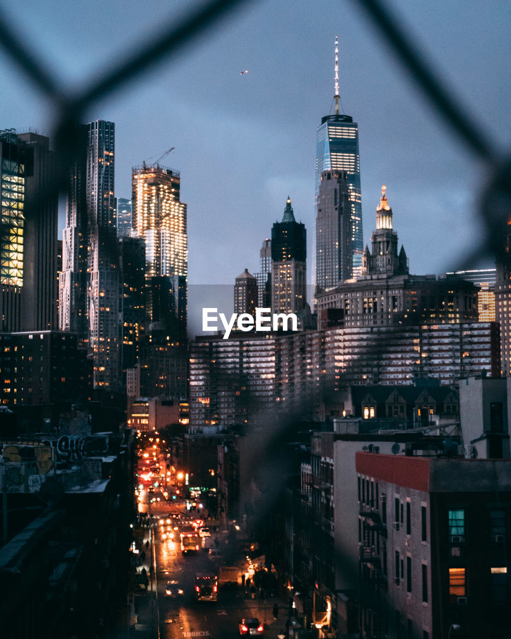 Illuminated cityscape against sky at night