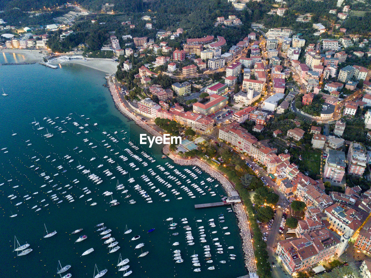 Aerial view of harbor by city