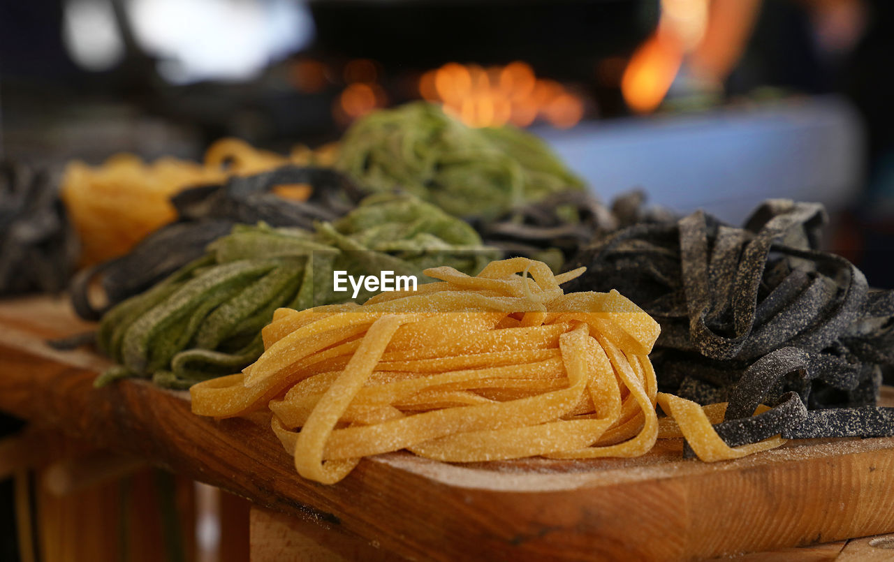 Close-up of raw pasta on table