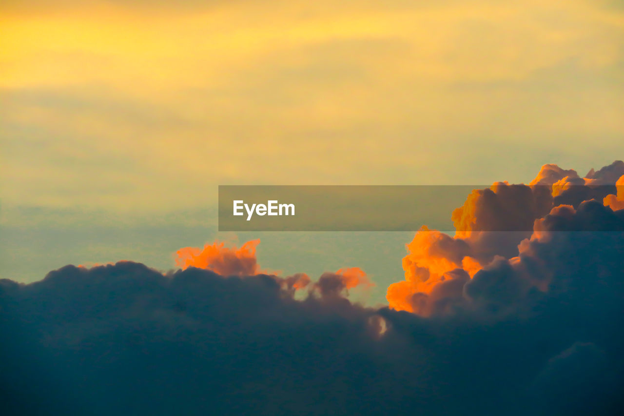 LOW ANGLE VIEW OF ORANGE CLOUDS IN SKY