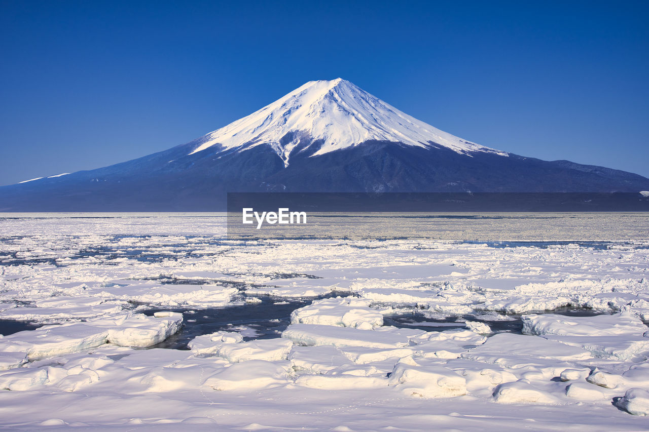 A composite photo nt,fuji and drift ice