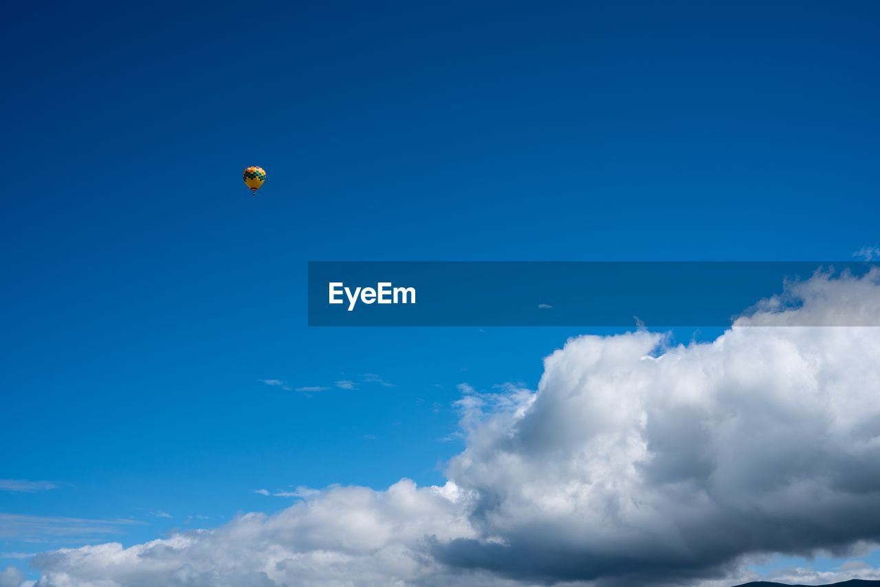 LOW ANGLE VIEW OF HOT AIR BALLOON IN SKY