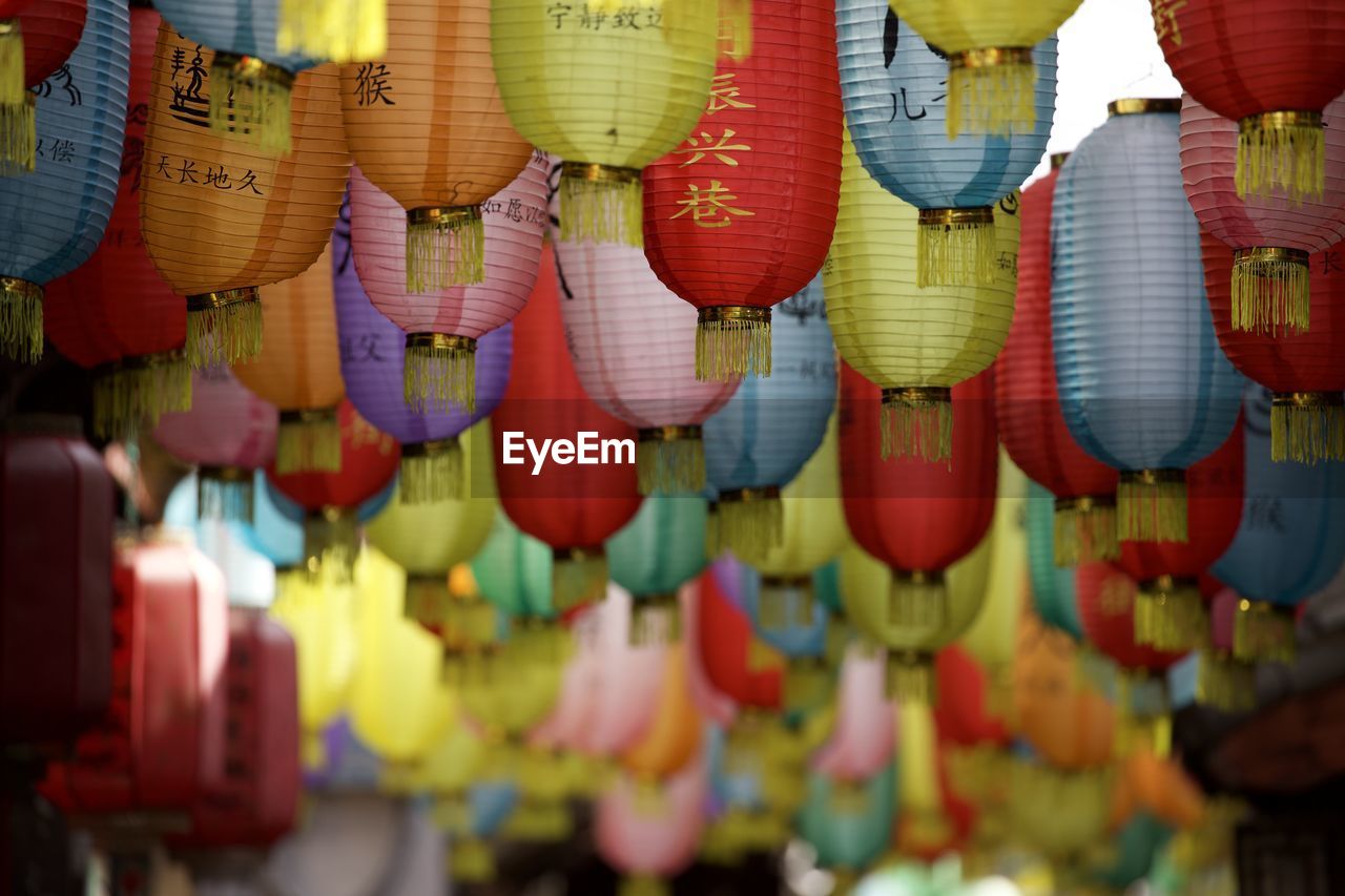 Full frame shot of multi colored lanterns hanging outdoors