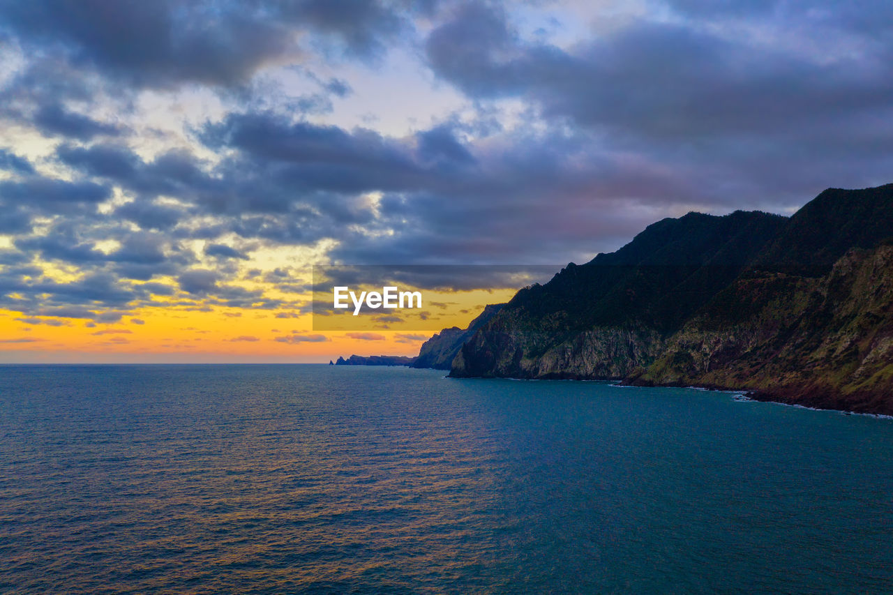 scenic view of sea against cloudy sky