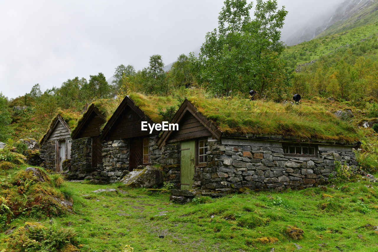 House on field against sky