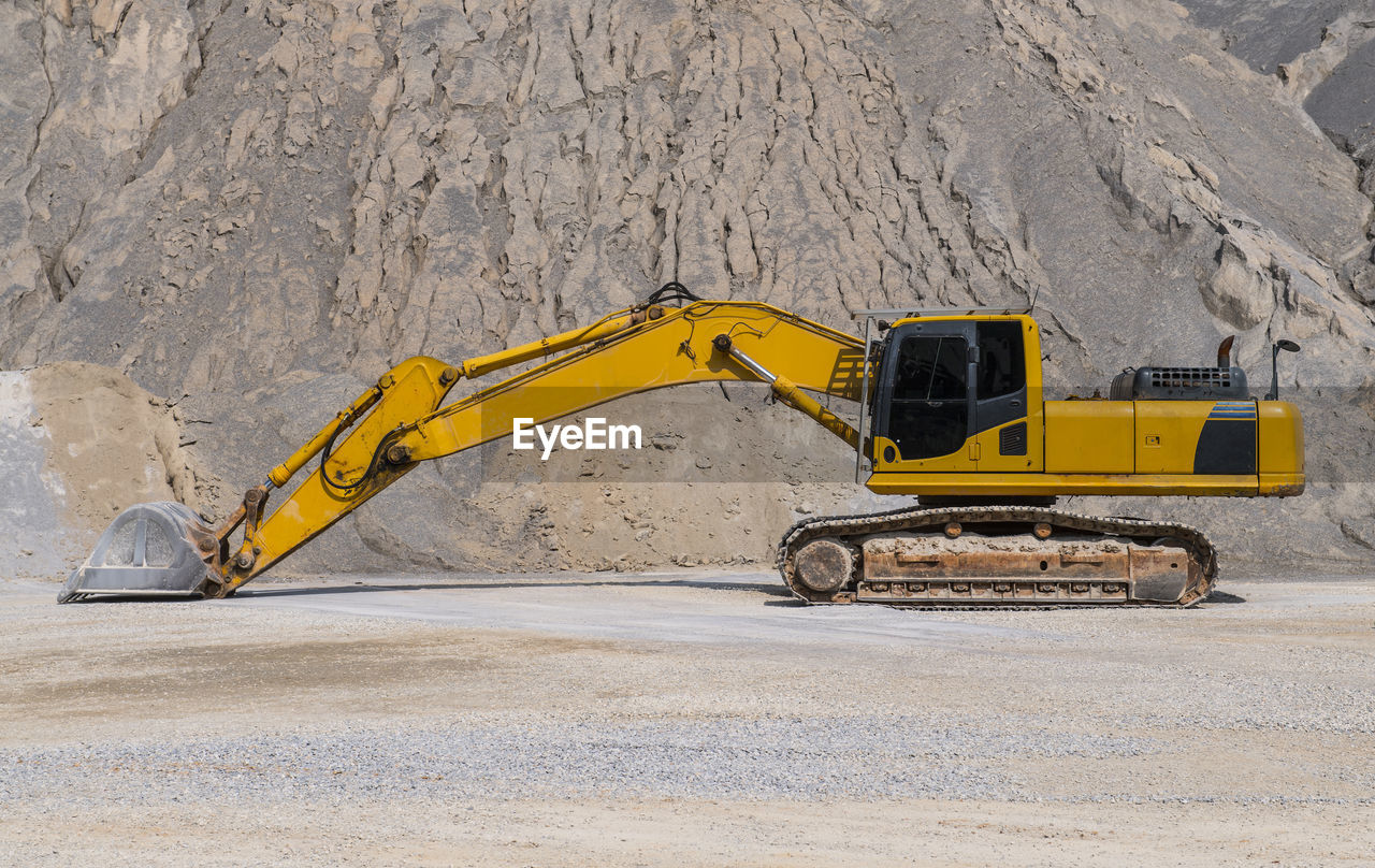 Excavator parked at gravel mine in thailand