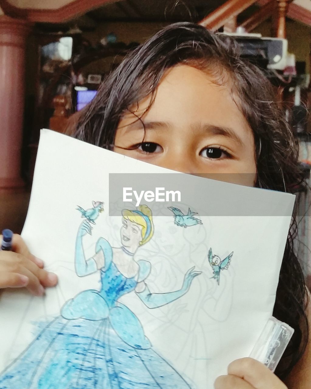 CLOSE-UP PORTRAIT OF CUTE GIRL WITH PAPER