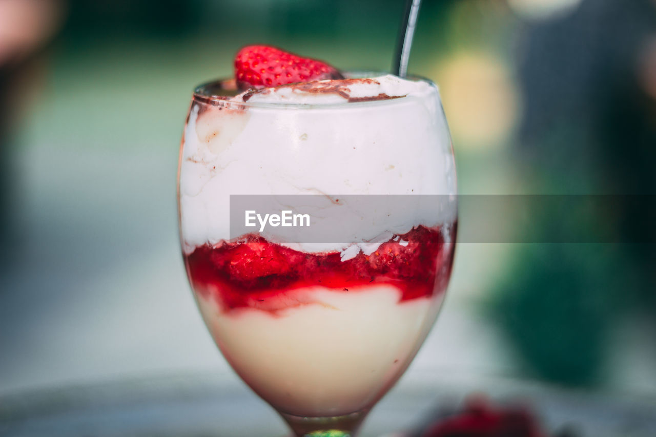 CLOSE-UP OF ICE CREAM WITH STRAWBERRY