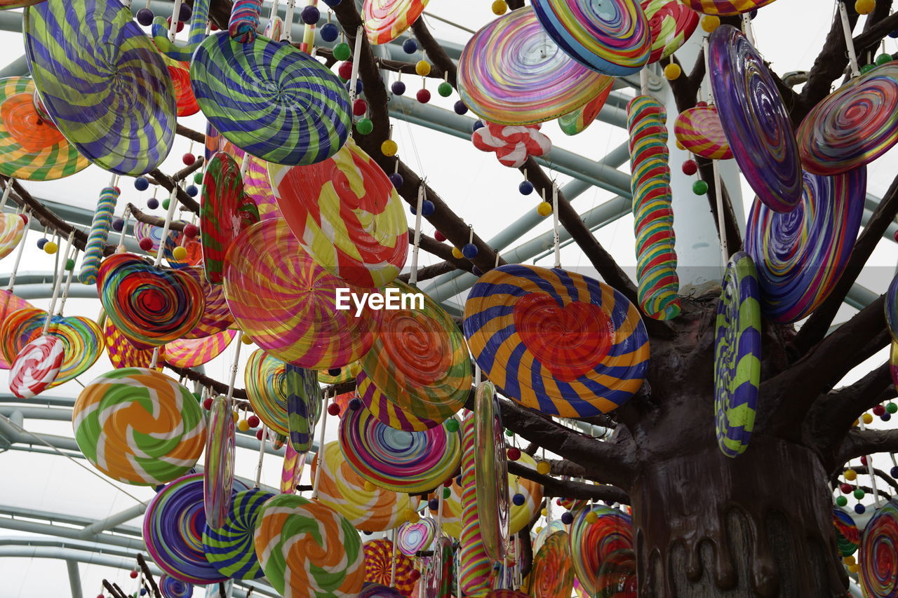 LOW ANGLE VIEW OF DECORATIONS HANGING ON CEILING