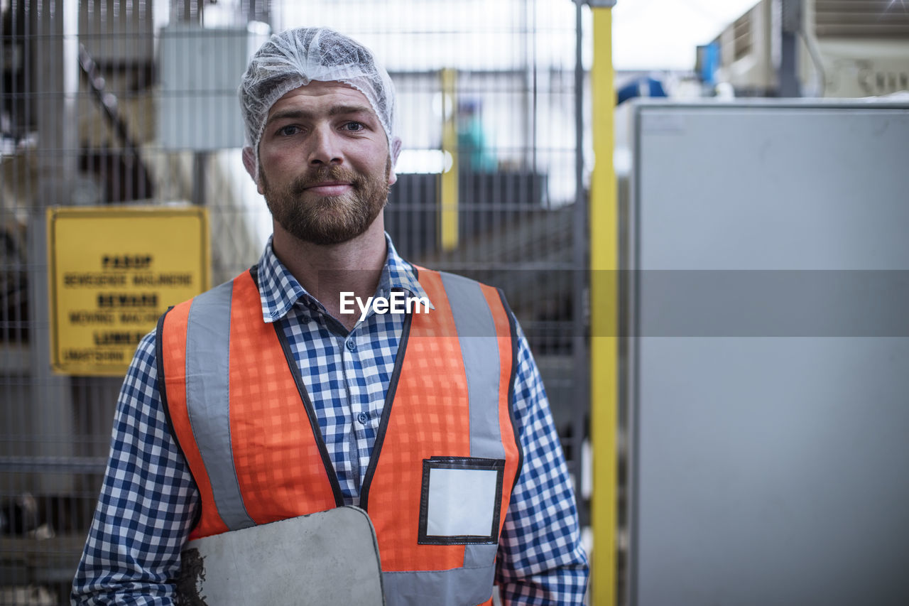 Portrait of confident inspector in factory