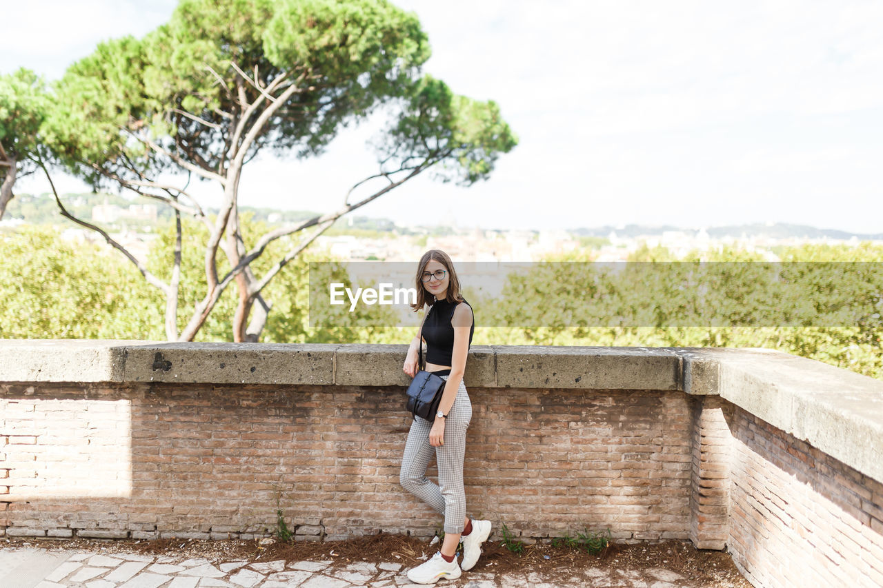 Young tourist walks the streets of rome in summer