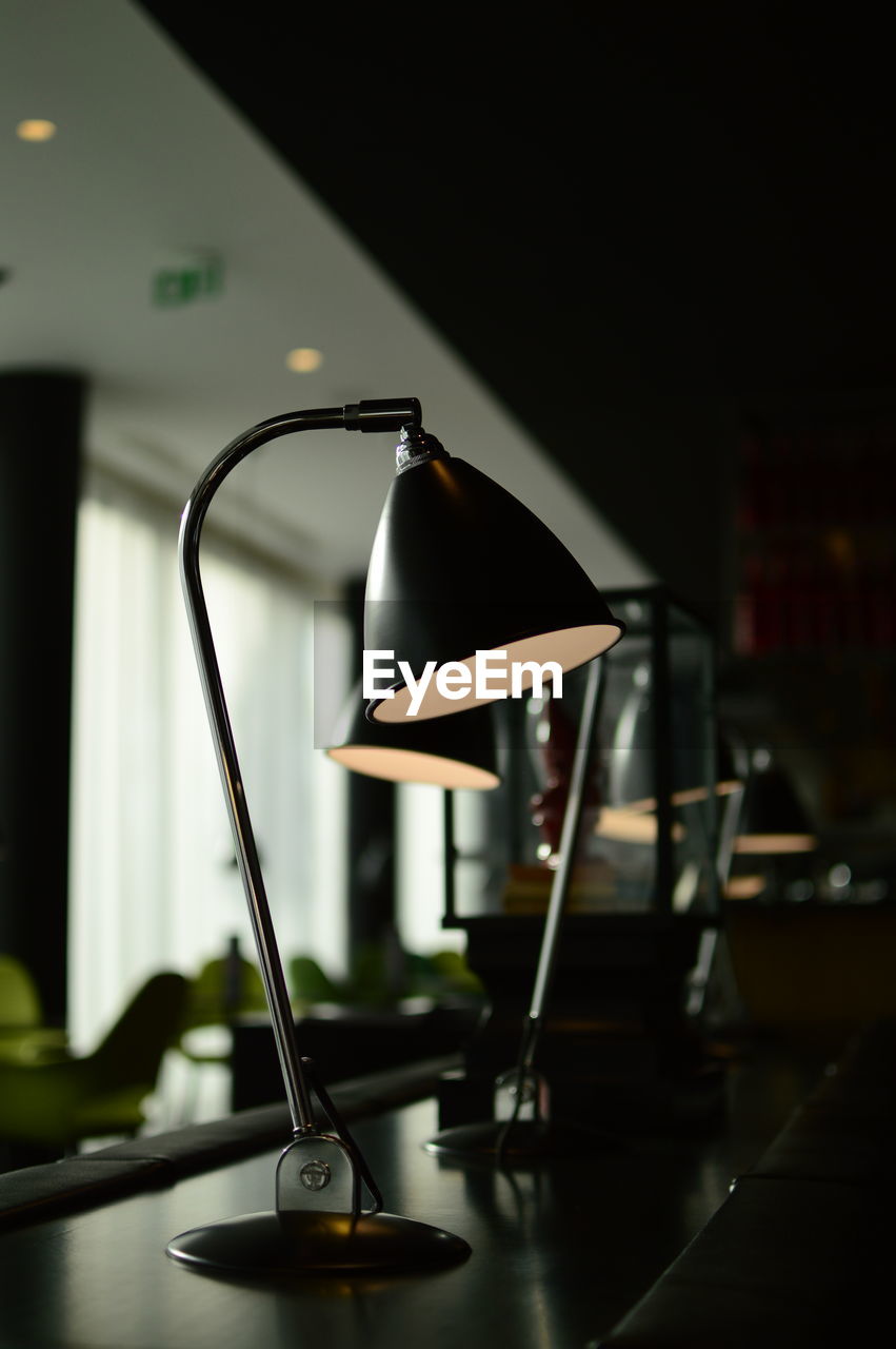 CLOSE-UP OF ELECTRIC LAMP ON TABLE