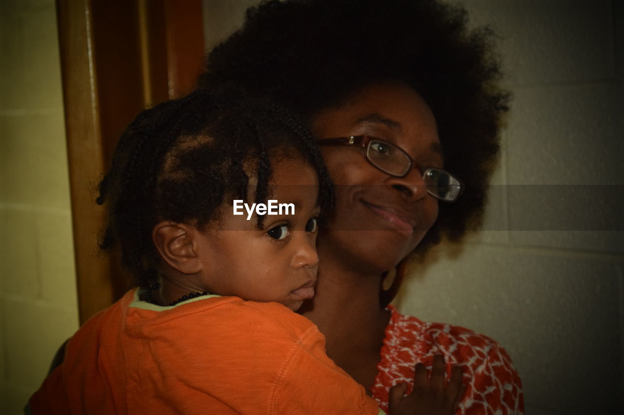 Close-up of smiling mother with cute boy