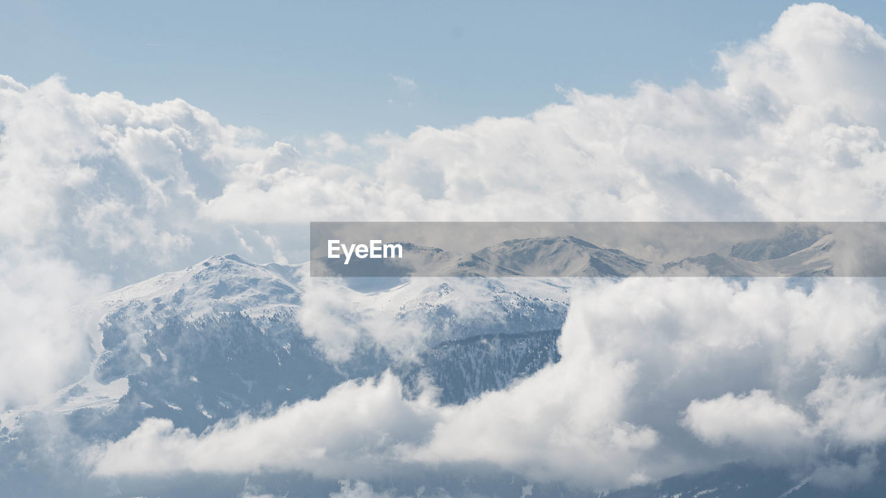 Scenic view of snowcapped mountains against sky