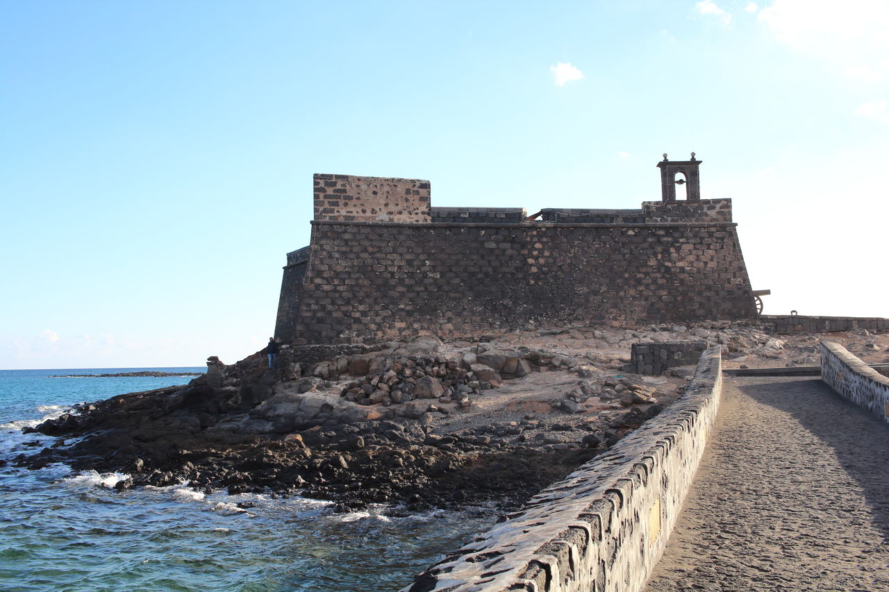 CASTLE ON BEACH AGAINST CLEAR SKY