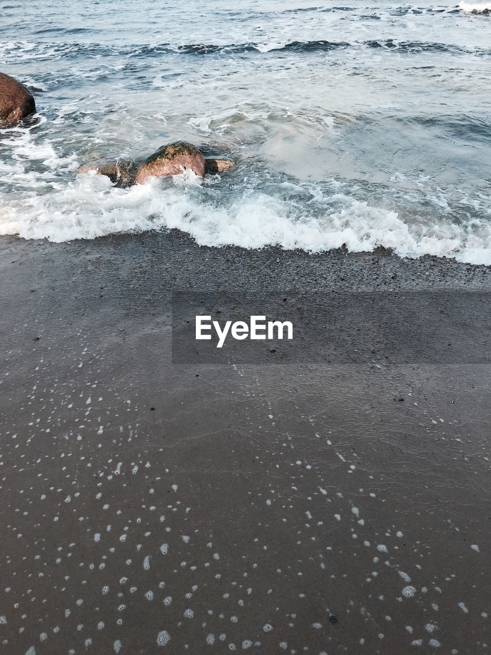 WAVES SPLASHING ON BEACH