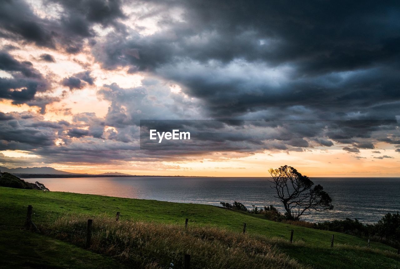 SCENIC VIEW OF SEA DURING SUNSET