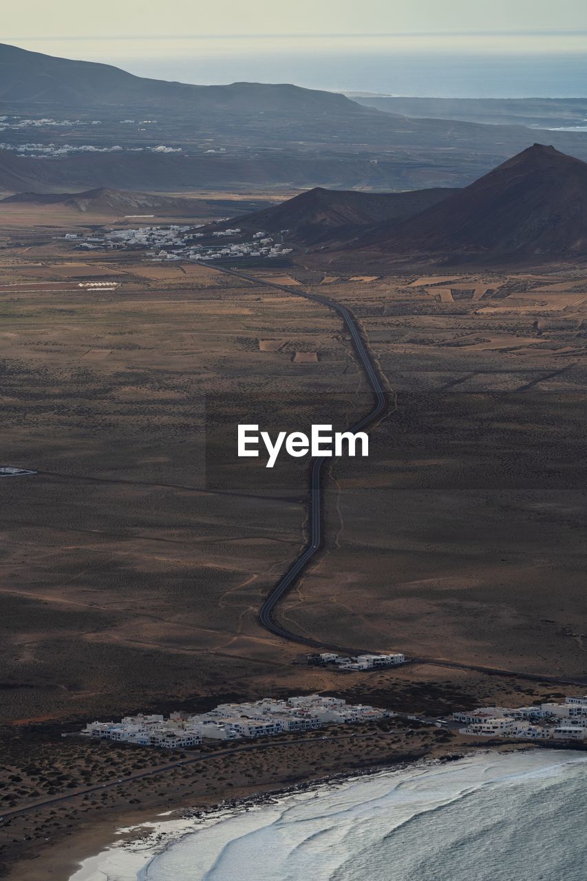 High angle view of road amidst landscape against sky