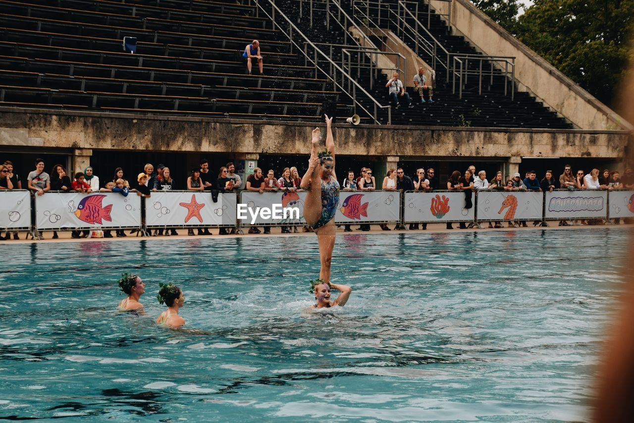 PEOPLE AT SWIMMING POOL