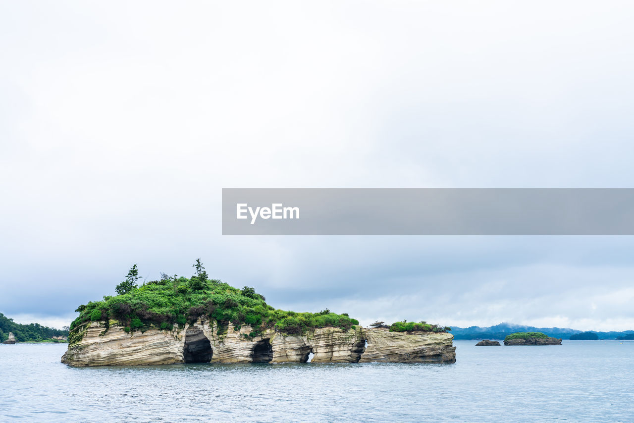 SCENIC VIEW OF ROCKS AGAINST SKY