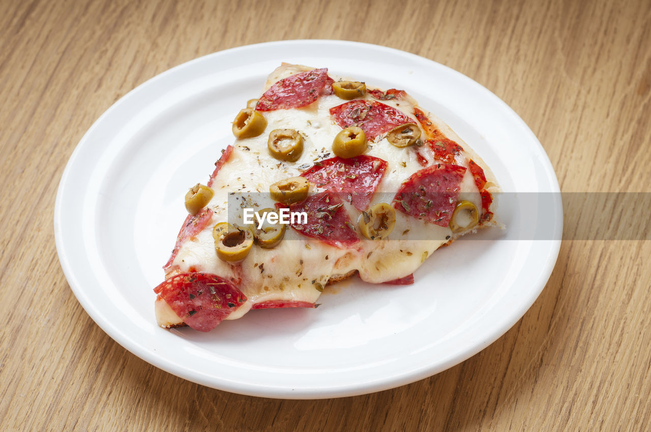 High angle view of pizza in plate on table