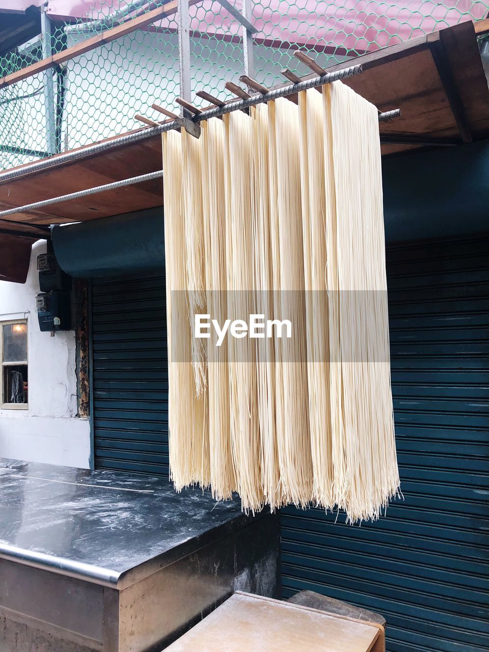 Noodles hanging on rod