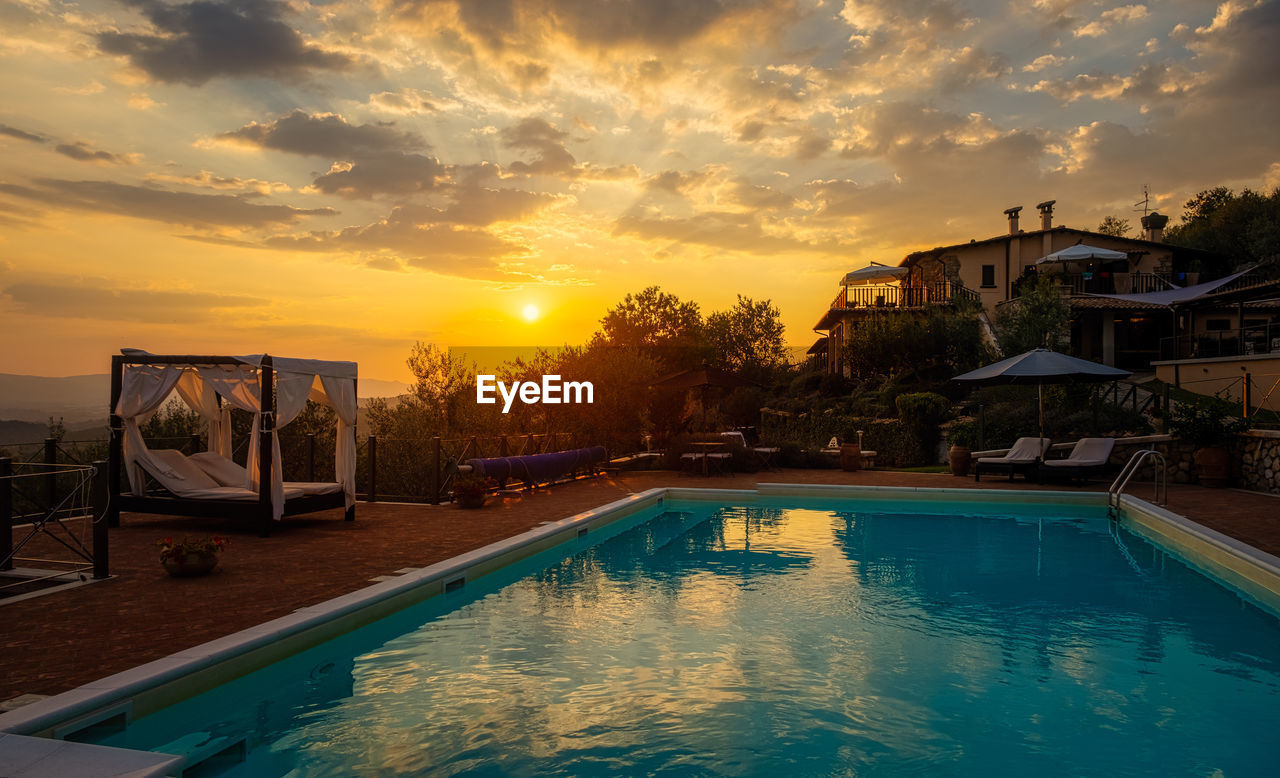 SWIMMING POOL AT SUNSET