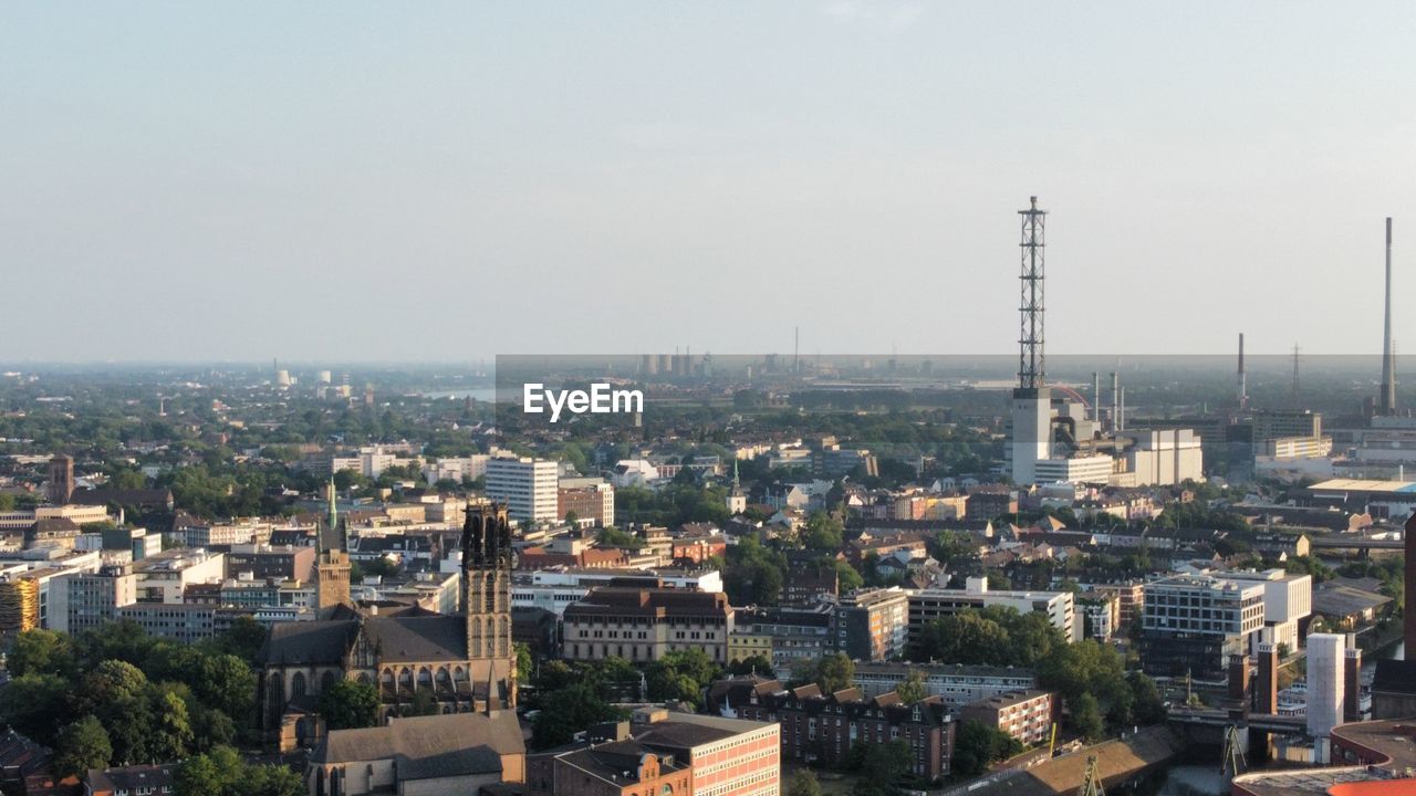 HIGH ANGLE VIEW OF BUILDINGS AGAINST SKY