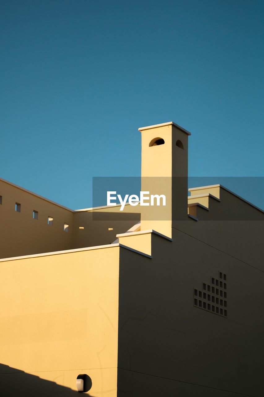 Low angle view of building against clear sky