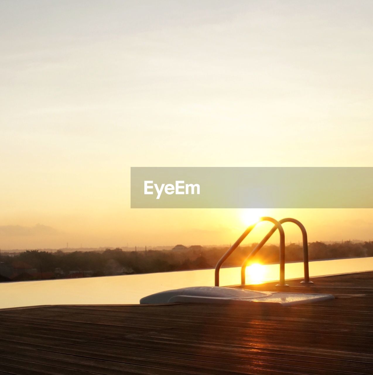 Scenic view of sea against clear sky during sunset