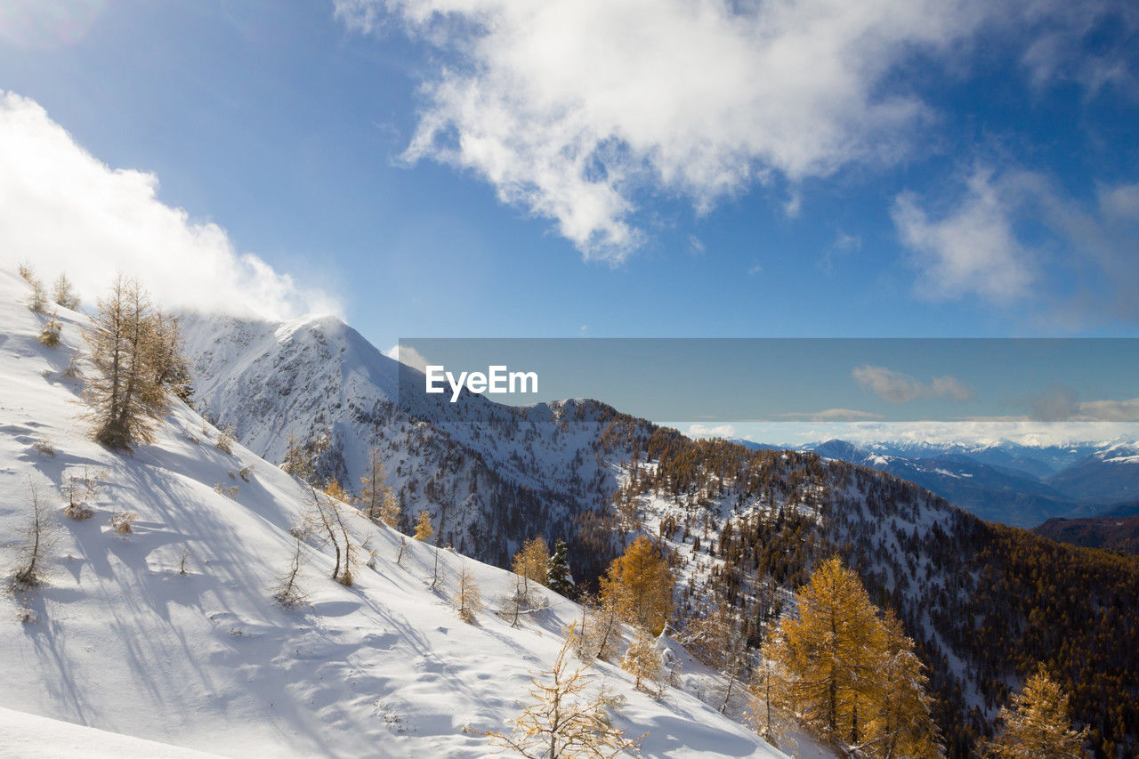 scenic view of snow covered mountains against sky