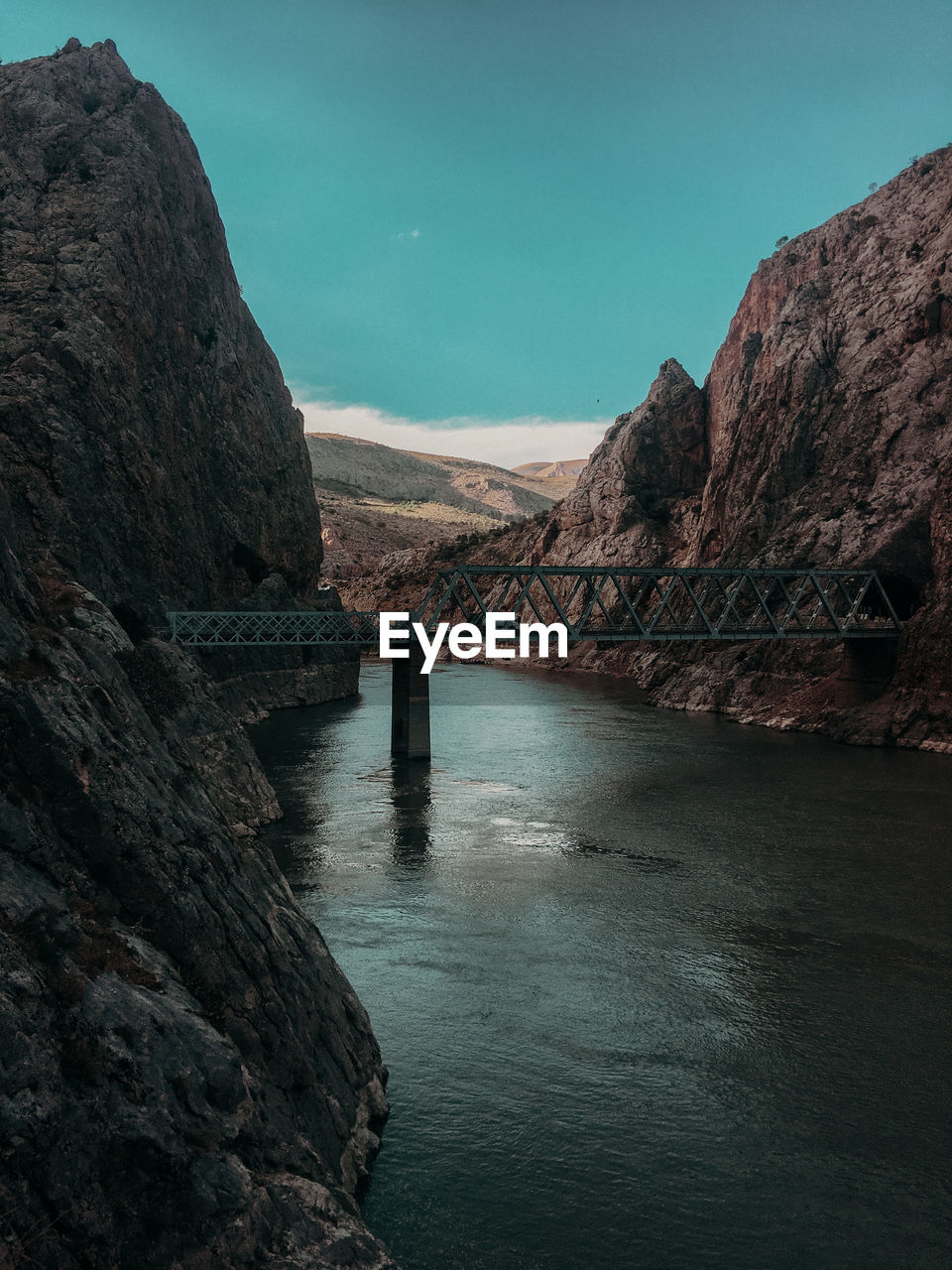 Scenic view of bridge over river against sky