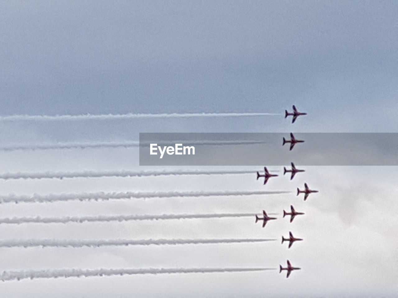Low angle view of airplanes against sky during airshow