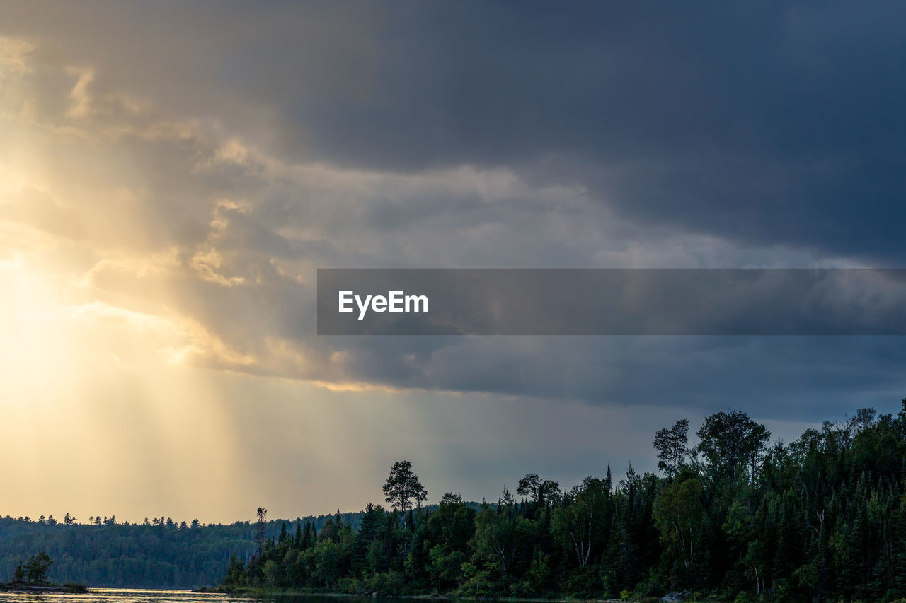 SCENIC VIEW OF RAINBOW AGAINST SKY AT SUNSET