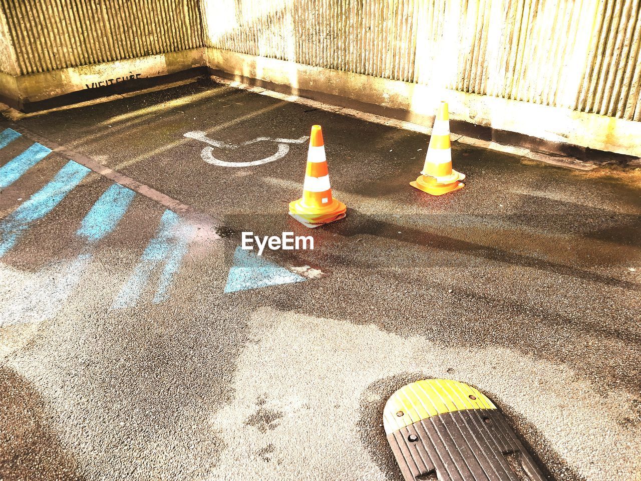 HIGH ANGLE VIEW OF YELLOW TOY ON STREET