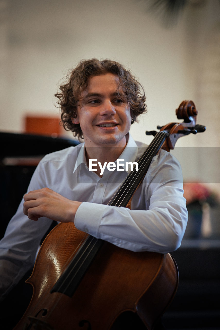 Portrait of man playing cello 